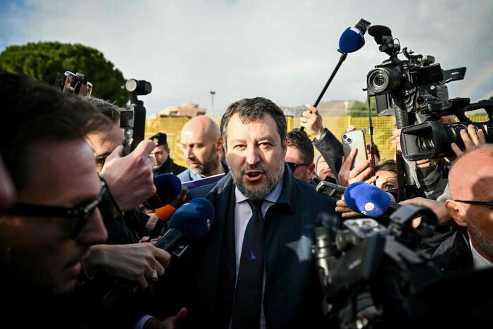 Italy's deputy premier Matteo Salvini talks to the press as he arrives at the Bunker Courtroom of the Pagliarelli prison in Palermo, Sicily, where a court is set to rule in his long-running trial, as he risks six years in jail for blocking a migrant rescue ship at sea. The far-right leader denies charges of abuse of office and the deprivation of liberty of 147 migrants on board the Open Arms charity ship in August 2019, when he was interior minister in a previous government. (Photo by Alberto PIZZOLI / AFP)