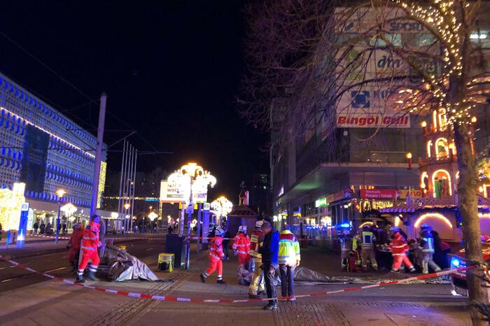 Police and rescue personnel cordon off the area next to a Christmas market, where a car crashed into a crowd killing and injuring people, according to media, on December 12, 2024 in Magdeburg. (Photo by Doerthe HEIN / DPA / AFP) / Germany OUT